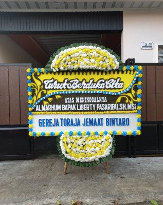 Papan Bunga Duka di Jurumudi Baru